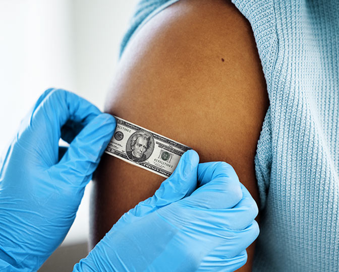 Doctor applying a $20 bill as a bandage to a person's arm.
